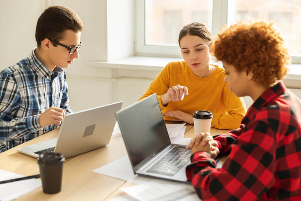 High school interns working together